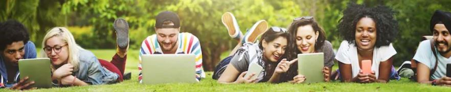 students-lying-on-grass-with-books